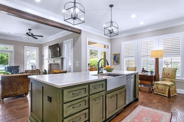 kitchen with pendant lighting, sink, dark wood-type flooring, a kitchen island with sink, and stainless steel dishwasher