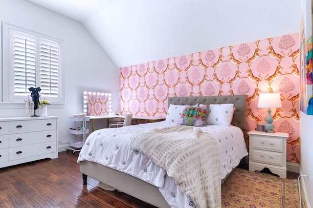 bedroom featuring vaulted ceiling and dark wood-type flooring