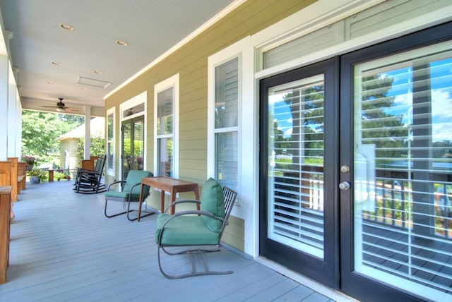 wooden terrace featuring covered porch