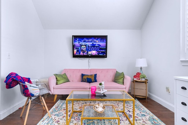 living room featuring lofted ceiling and dark hardwood / wood-style floors