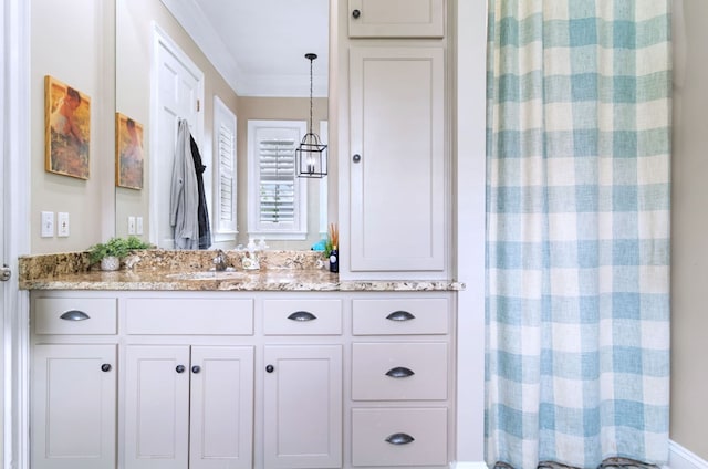 bathroom featuring vanity, crown molding, and a shower with shower curtain