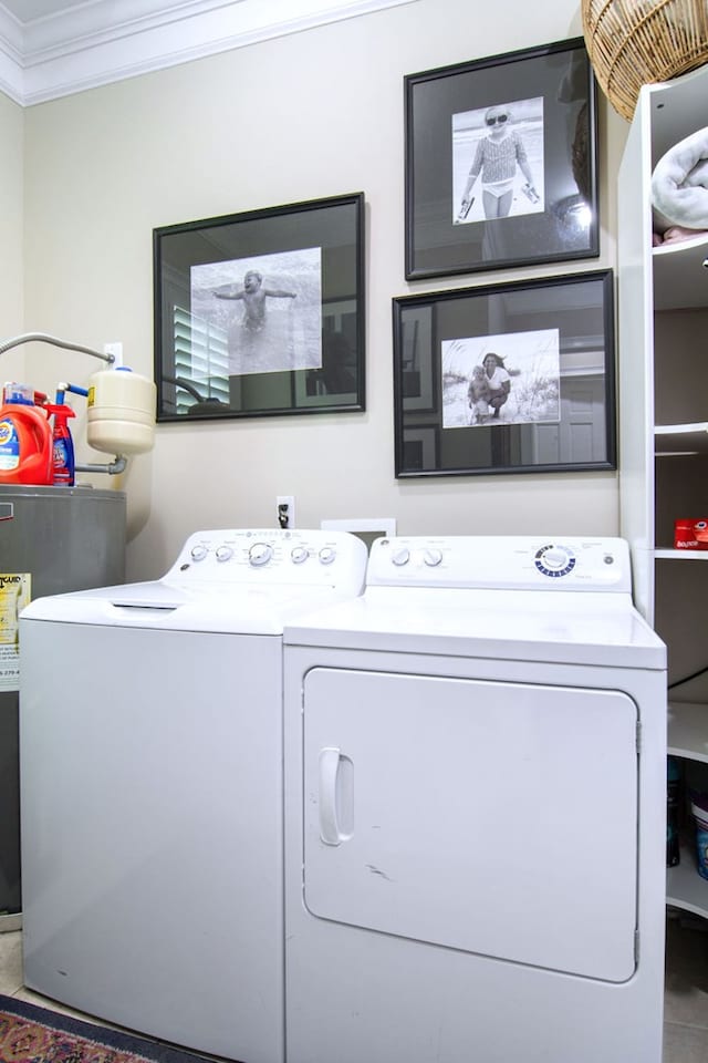 laundry area featuring crown molding, separate washer and dryer, and water heater