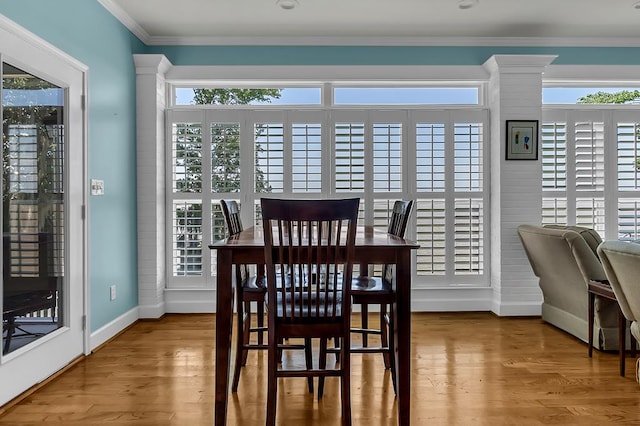 190 Scenic Rt, Cordele, GA 31015 - dining area with baseboards, wood finished floors, and crown molding
