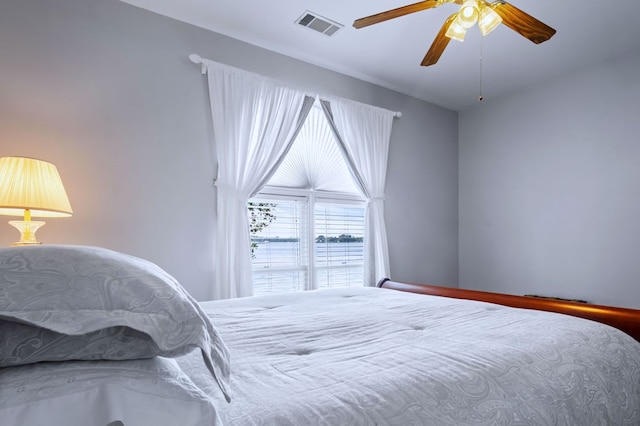 bedroom with visible vents and a ceiling fan