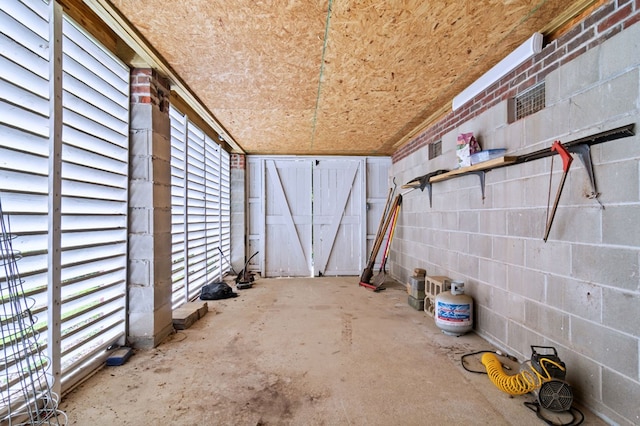 interior space featuring a gate and fence