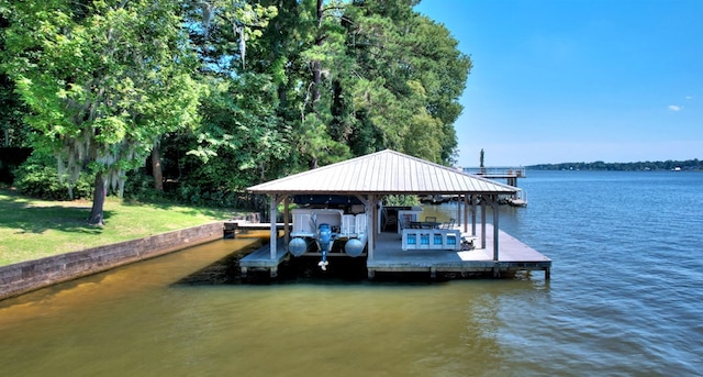 dock area with a water view and boat lift