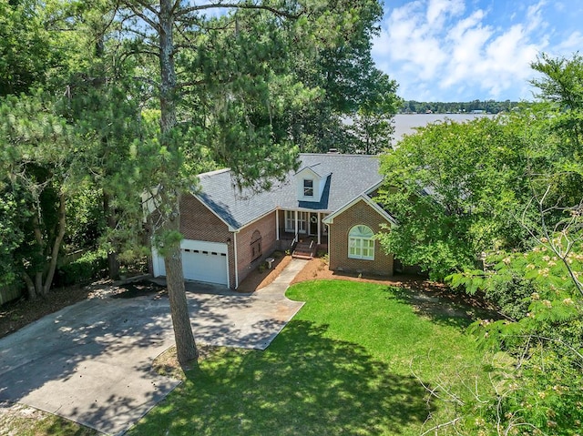 190 Scenic Rt, Cordele, GA 31015 - view of front facade with driveway, an attached garage, and a front lawn