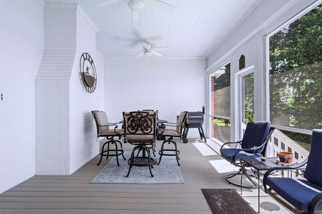 sunroom / solarium with ceiling fan