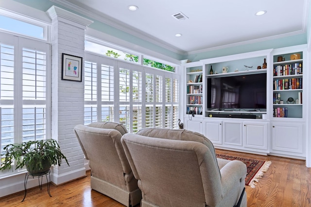 living room with visible vents, recessed lighting, light wood-style flooring, and crown molding