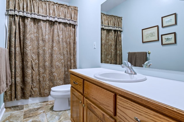 full bathroom featuring toilet and vanity