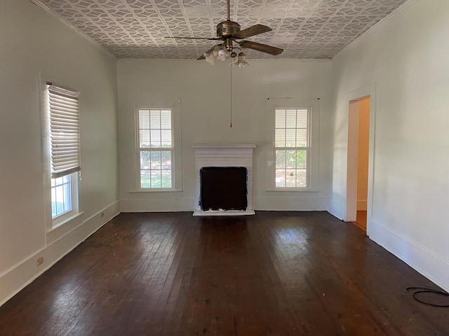 unfurnished living room with dark wood-type flooring, ceiling fan, and plenty of natural light