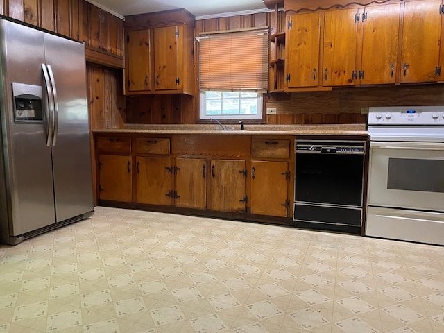 kitchen featuring white electric stove, dishwasher, and stainless steel refrigerator with ice dispenser