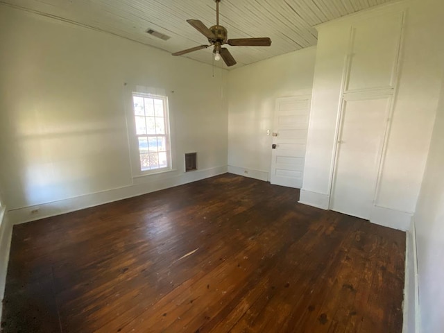 interior space featuring dark wood-type flooring and ceiling fan