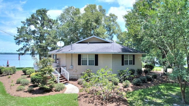 view of front of home featuring a water view