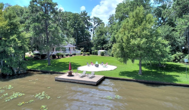 view of dock featuring a water view and a lawn