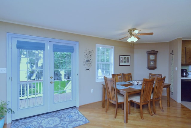 dining room with light hardwood / wood-style floors, ceiling fan, and french doors