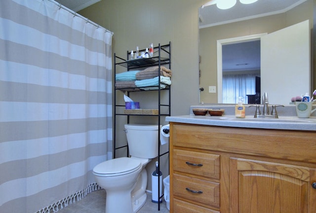 bathroom featuring crown molding, toilet, tile patterned flooring, and vanity