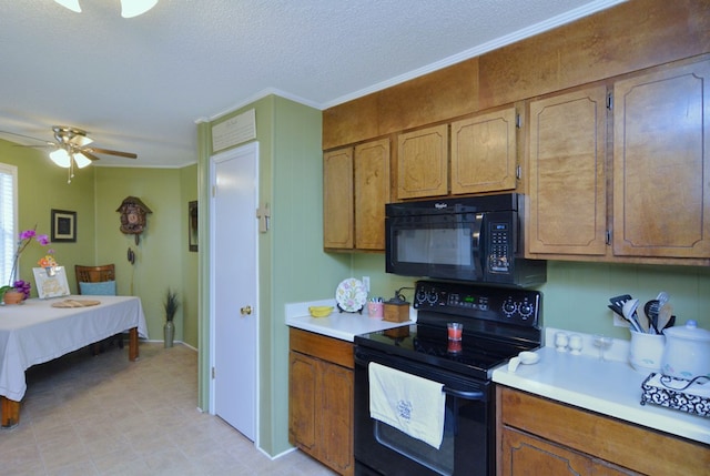 kitchen featuring black appliances, ceiling fan, crown molding, and a textured ceiling