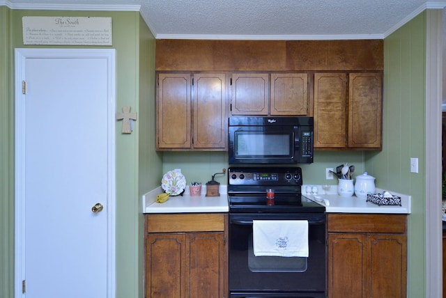 kitchen featuring crown molding, black appliances, and a textured ceiling