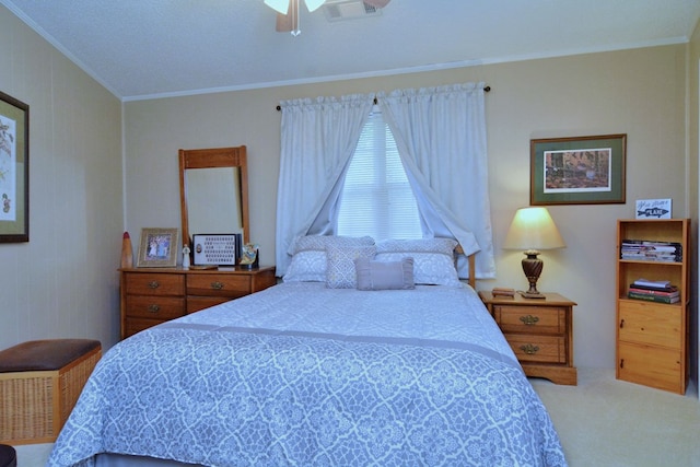 bedroom featuring ceiling fan, carpet, crown molding, and a textured ceiling