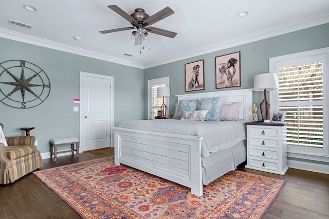 bedroom with a ceiling fan, dark wood-style flooring, visible vents, and crown molding