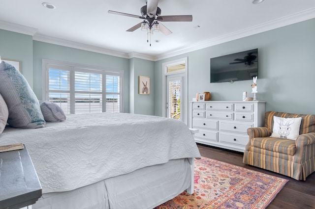 bedroom with access to exterior, multiple windows, dark wood finished floors, and crown molding