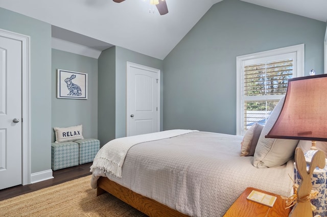 bedroom featuring vaulted ceiling, ceiling fan, and dark wood-style flooring