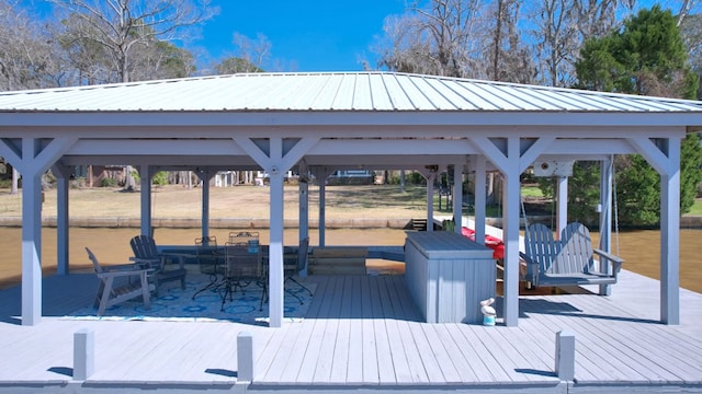 view of dock with a water view and a gazebo