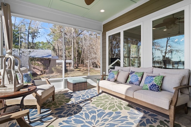 sunroom with a ceiling fan