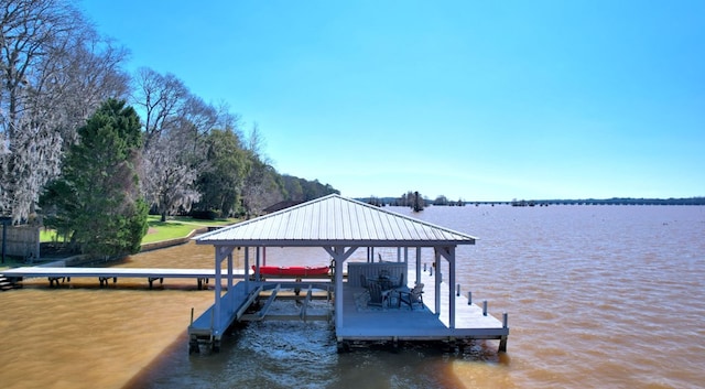 dock area with a water view and boat lift