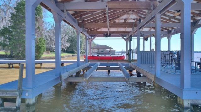 view of dock with a water view and boat lift