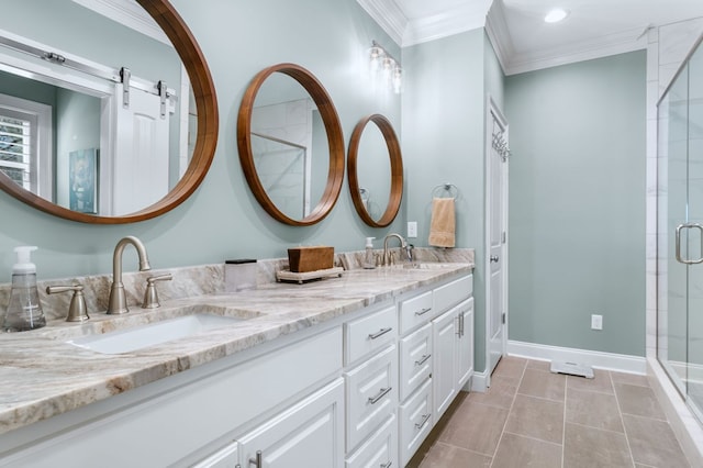 bathroom with ornamental molding, a stall shower, a sink, and baseboards