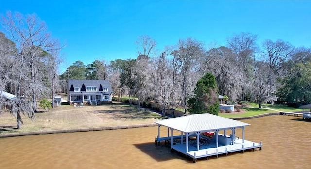 dock area with a water view and boat lift