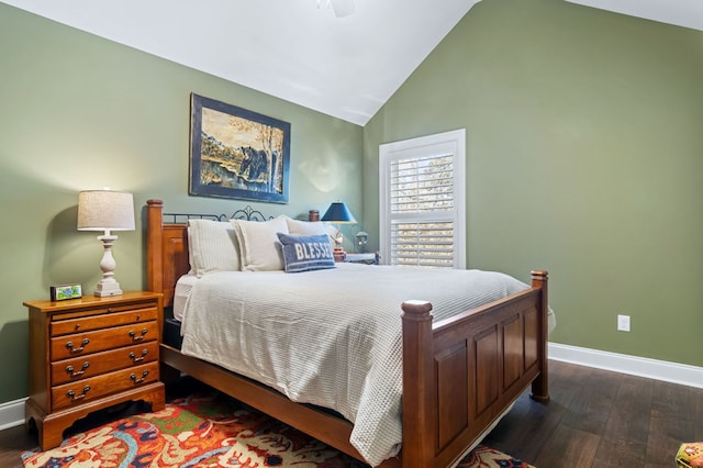 bedroom featuring dark wood-style floors, baseboards, and vaulted ceiling