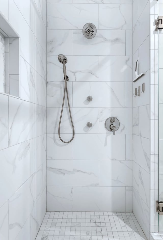 full bath featuring a tile shower