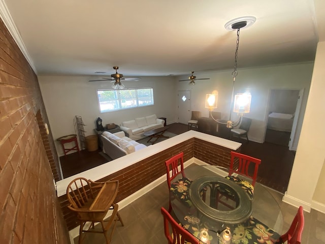 interior space featuring ceiling fan and ornamental molding