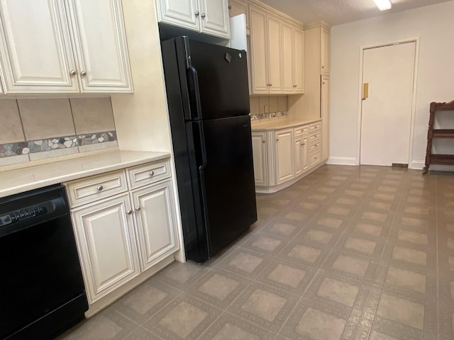 kitchen with black appliances and tasteful backsplash