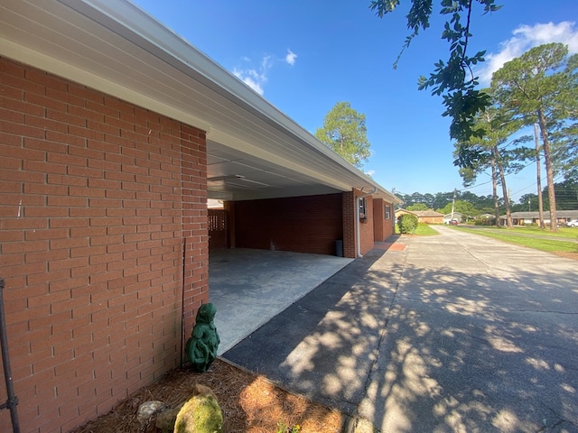 view of property exterior with a carport