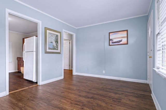 unfurnished room featuring crown molding and dark wood-type flooring