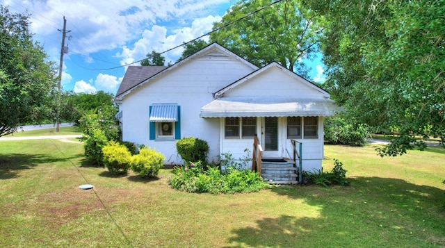 view of front of home with a front yard