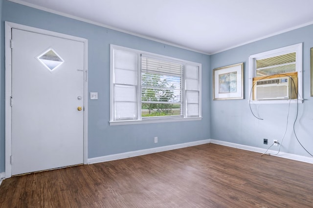 entryway featuring cooling unit, ornamental molding, and dark hardwood / wood-style flooring