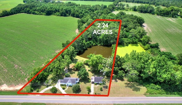 birds eye view of property with a rural view and a water view