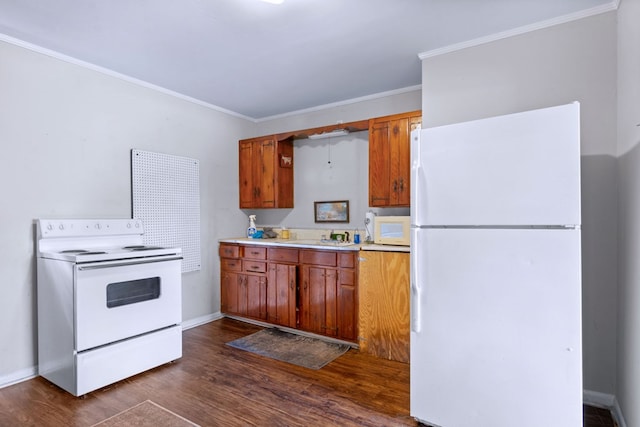 kitchen featuring white appliances, dark wood-type flooring, and ornamental molding