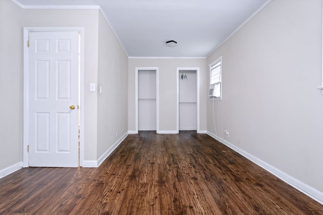 interior space with crown molding, dark hardwood / wood-style floors, and cooling unit