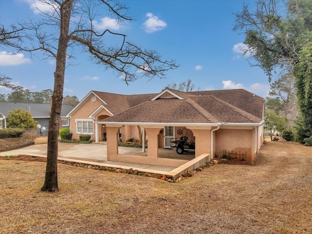 rear view of property featuring a patio area