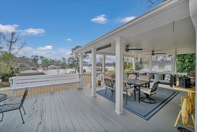 wooden terrace featuring ceiling fan