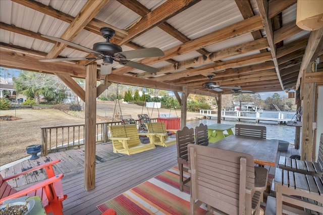 wooden terrace featuring ceiling fan