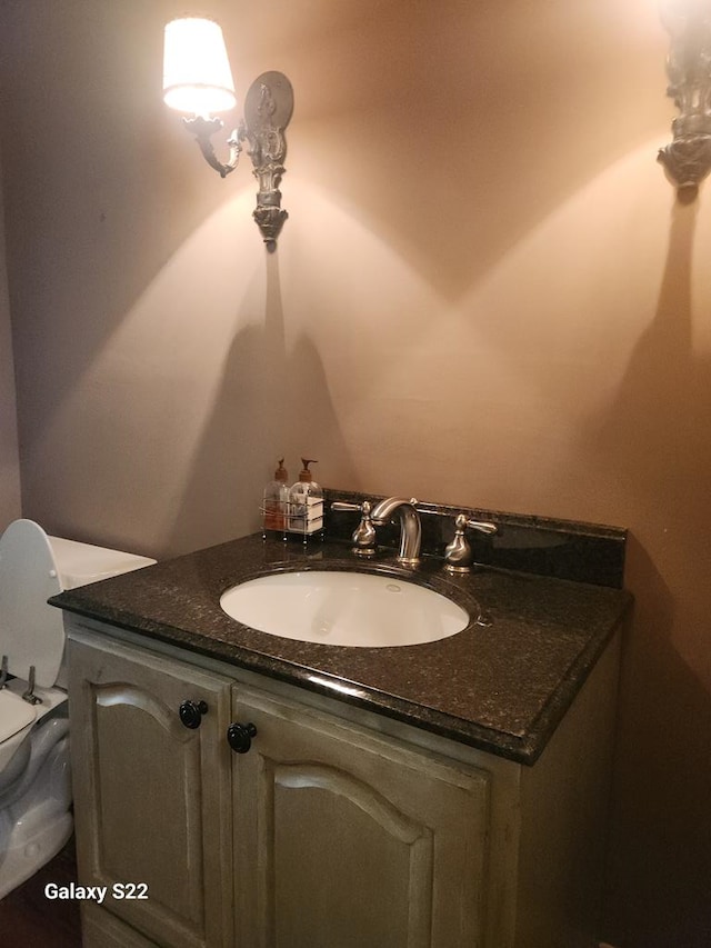 bathroom with vanity and toilet