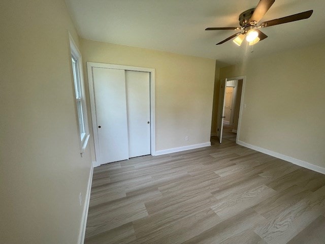 510 E 25th Ave, Cordele, GA 31015 - unfurnished bedroom featuring baseboards, light wood-style flooring, a closet, and ceiling fan