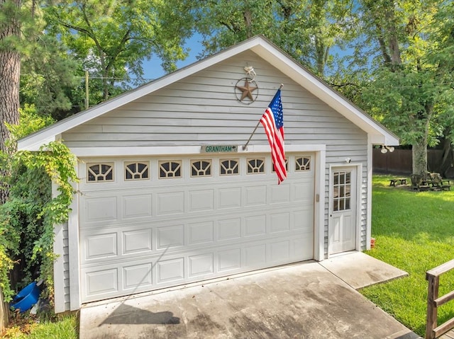 garage with a yard